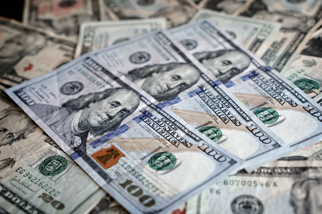 Close-up of various US dollar bills highlighting finance and economy.