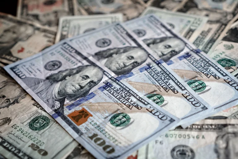 Close-up of various US dollar bills highlighting finance and economy.