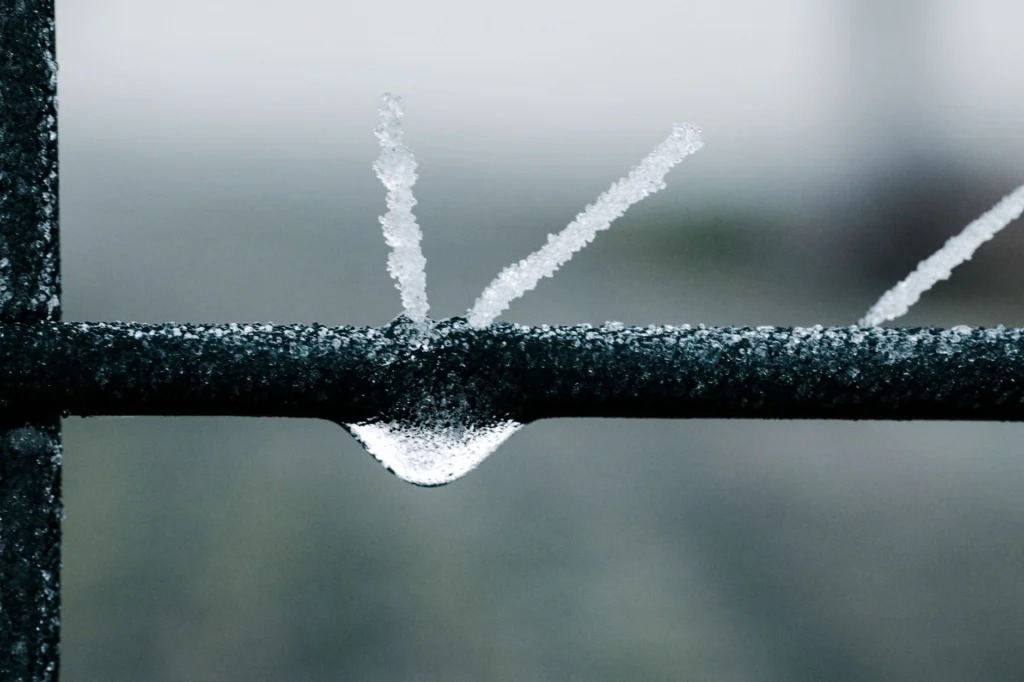 Close-up of ice crystals forming on a metal fence in winter, Andernach.