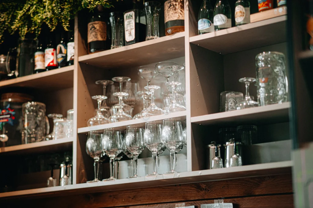 Elegantly arranged glassware in a bar setting, emphasizing cleanliness and organization.
