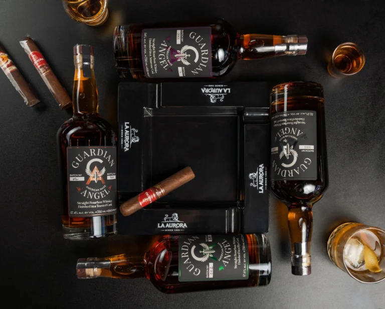 A captivating flat lay of Guardian Angel bourbon bottles and cigars in New Orleans bar ambiance.